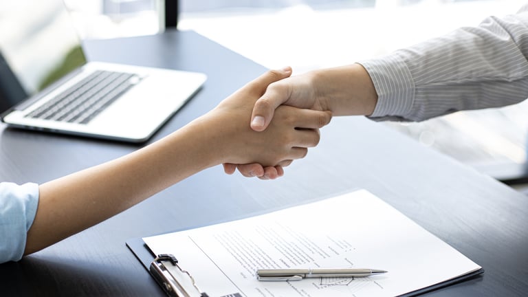 Employer and Candidate Shake Hands 